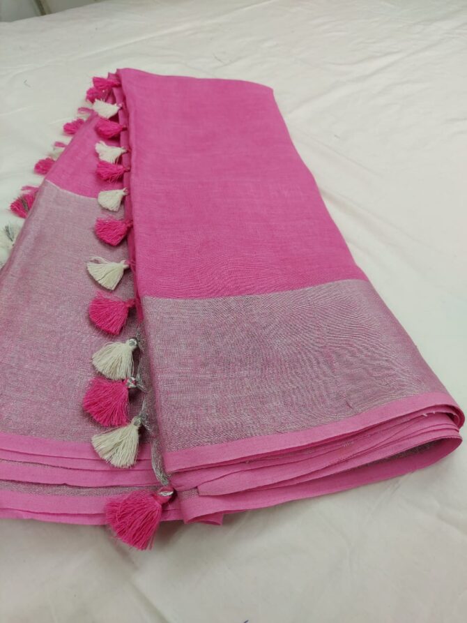 Taffy Pink Silver Zari Border With Off-White and Pink Tassel Solid Color Saree